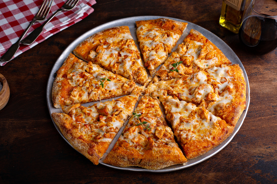 BBQ chicken pizza cut into slices